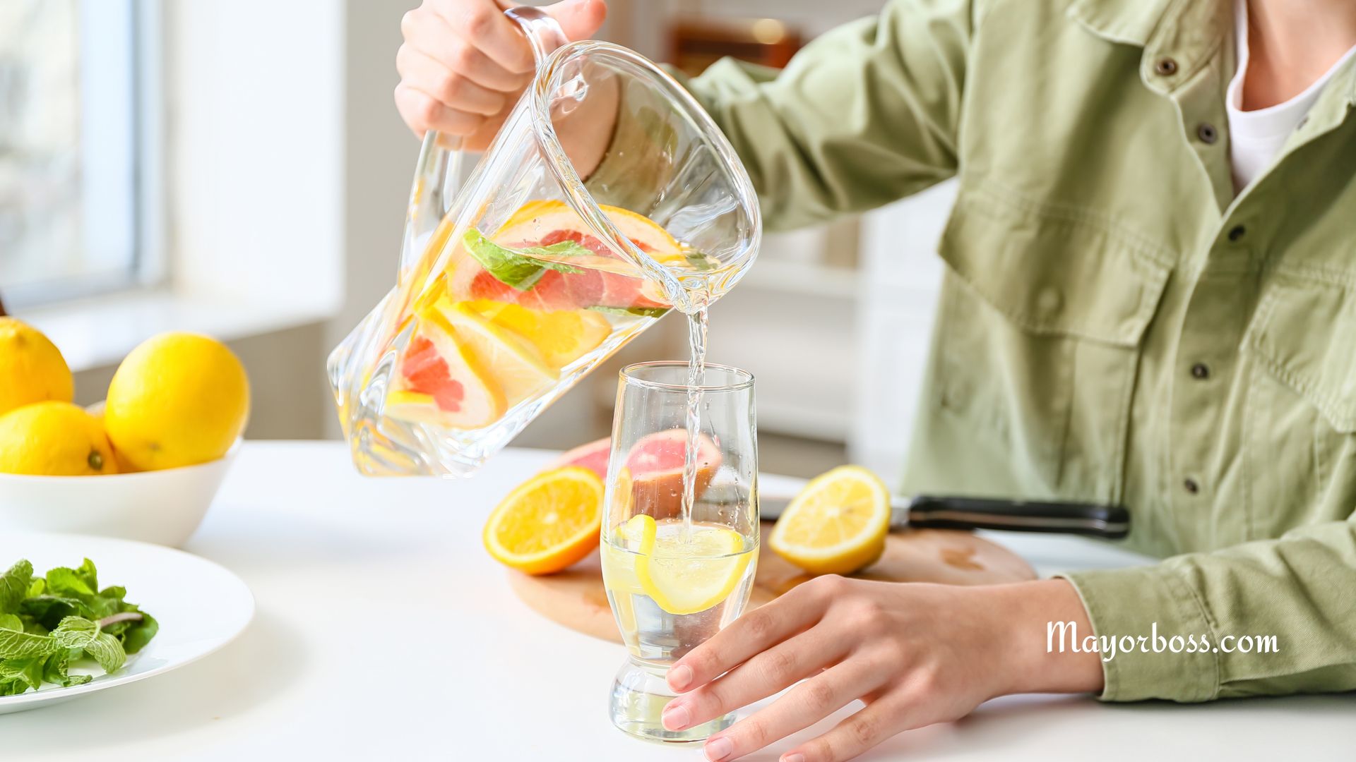 A woman enjoying lemon water, as part her natural ways to detox every day for better health.
