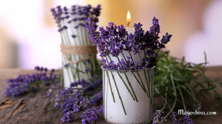 candles with lavender flowers on a wooden table